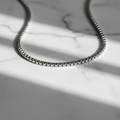ROVIA Silver Box Chain on white marble surface