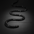 ROVIA Black Tennis Chain with black zirconia stones on matte black surface
