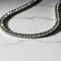 ROVIA Silver Tennis Chain with AAA zirconia on white marble
